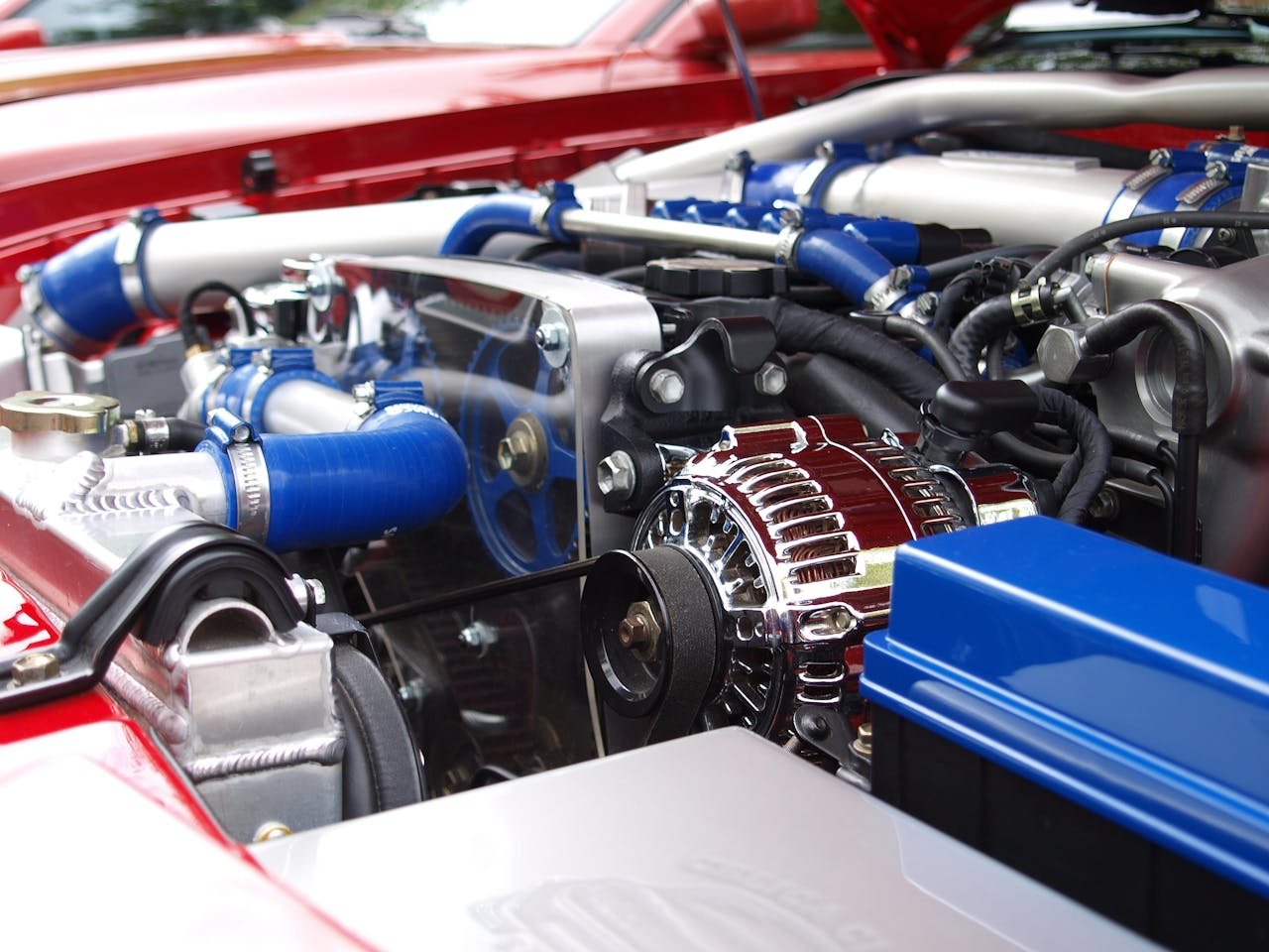 Why You Should Choose a Local Automotive Specialist in Durham Region Detailed view of a clean modern car engine with vibrant colored components and sleek design.